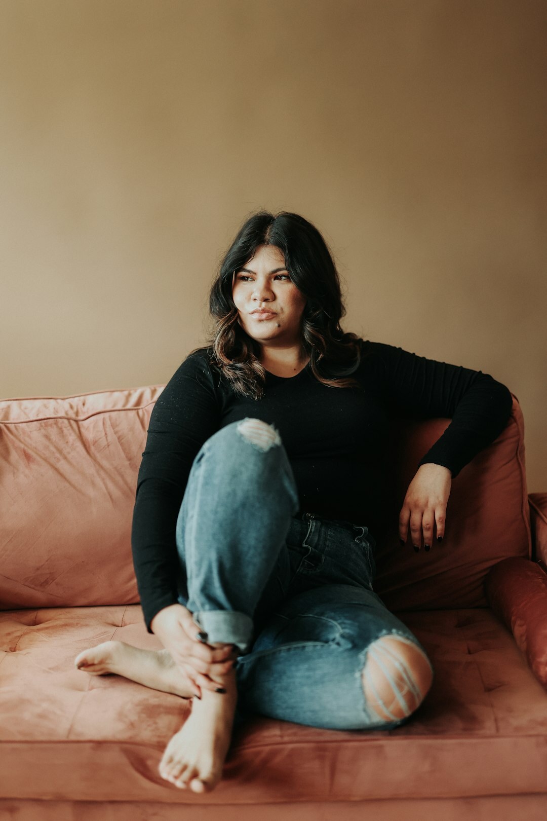 Studio portrait of a Croatian woman podcast host smiling
